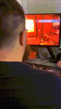 a man is playing a video game called demonic possession on a computer screen