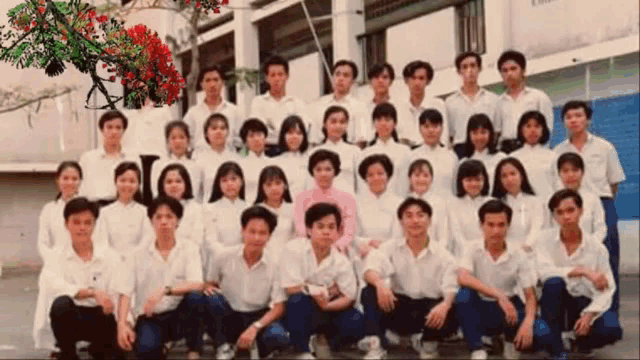 a group of people posing for a picture with the letter i on the bottom