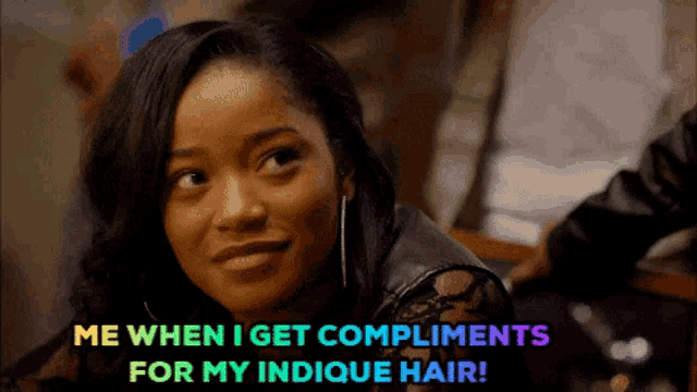 a woman is smiling and says me when i get compliments for my indicque hair