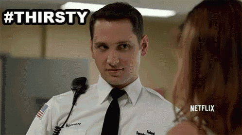 a man in a white shirt and tie is talking to a woman .