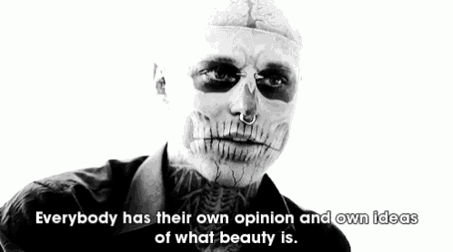 a black and white photo of a man with a skull painted on his face .