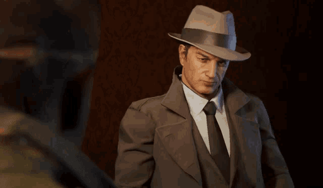 a man in a suit and hat with the words is this a goddamn joke below him