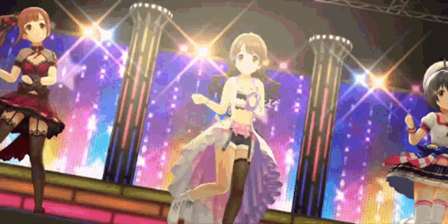 three anime girls are dancing on a stage in front of a crowd .