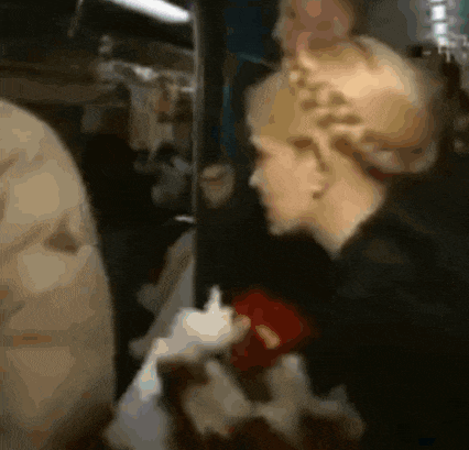 a blurred image of a woman holding a red heart