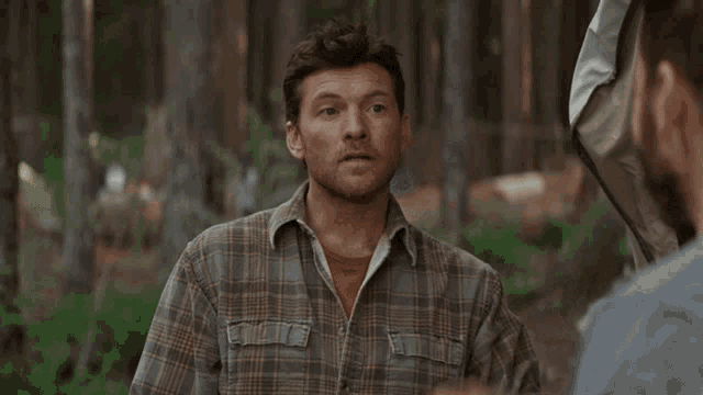 a man in a plaid shirt with the words that sounds good written below him