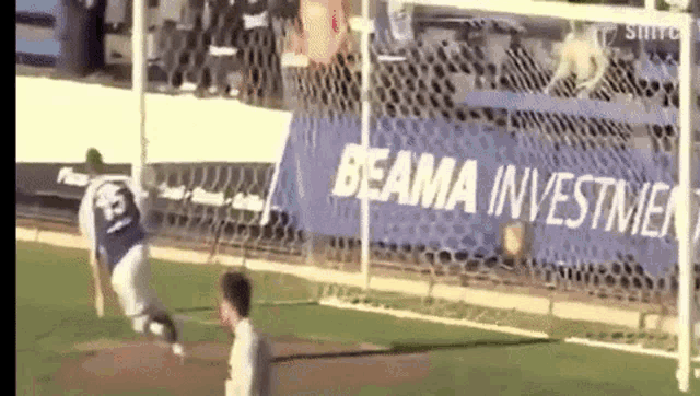 a soccer player wearing a number 15 jersey is kicking the ball