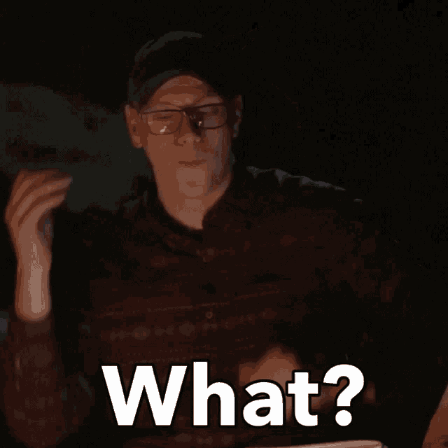 a man wearing glasses and a hat is asking what