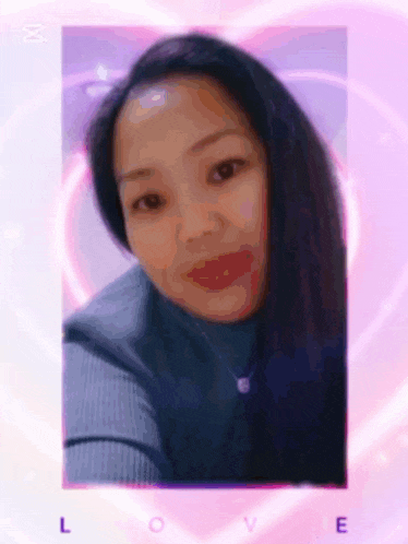 a close up of a woman 's face with a pink heart in the background