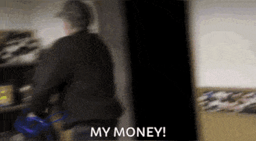 a blurry picture of a man with the words " my money " in the corner