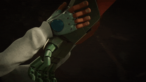a close up of a person 's hand wearing a glove