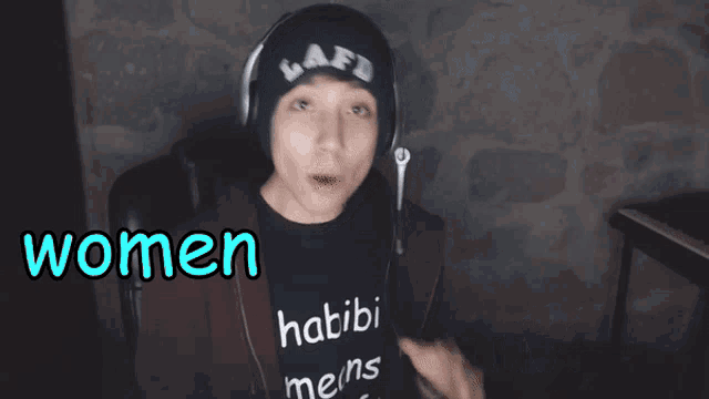 a woman wearing headphones says that women beaters are not attractive