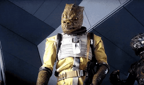 a man in a yellow suit has a belt with a buckle that has the number 10 on it