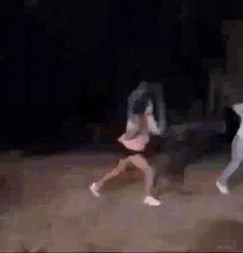 a woman is playing tennis with a hula hoop in her hand .