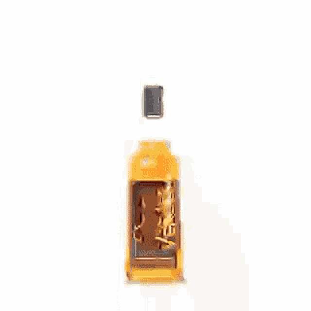 a bottle of ron añejo heroes is sitting on a white table .