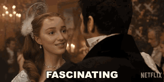 a man and woman are dancing and the word fascinating is on the screen