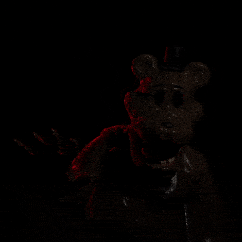 a close up of a person 's face with their mouth open in the dark