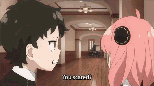 a boy and a girl are standing next to each other and the girl is saying you scared