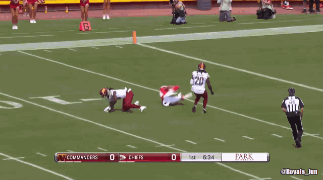 a football game between the commanders and the chiefs is being played