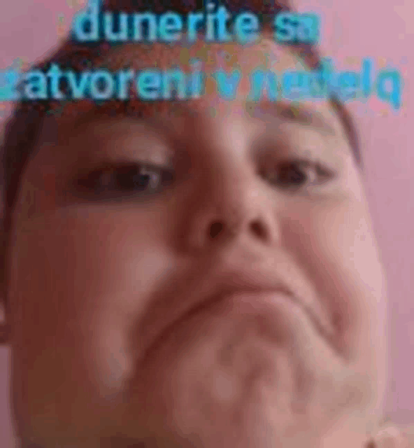 a close up of a person 's face with a pink background and the words dunite sa otvoreni u netelj .
