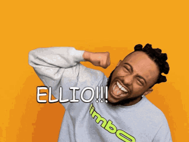 a man wearing a sweater that says limbo on it is laughing