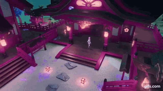 a woman is standing on a stage in front of a purple building .