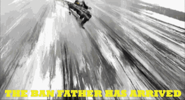 a black and white photo of a snowmobile with the words " the ban father has arrived " below it