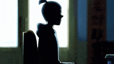 a silhouette of a person sitting in front of a window with chinese writing on the wall behind them