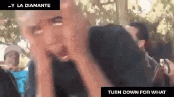 a man with his hands on his face and the words turn down for what on the bottom right