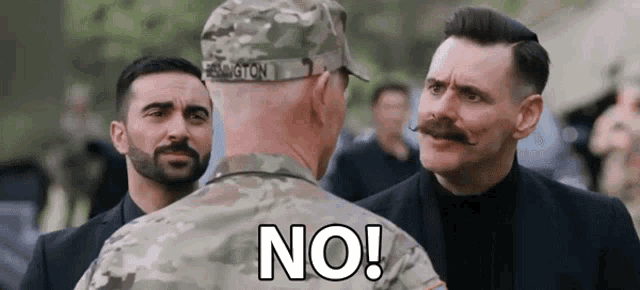 a man in a military uniform is standing next to another man with a mustache and says no .