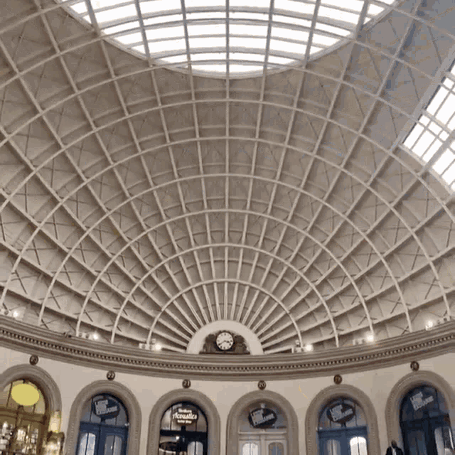 a building with a dome ceiling and a sign that says ' swiss chocolate ' on it