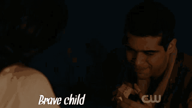 a man and a woman are looking at each other and the words brave child are on the screen