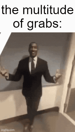 a man in a suit and tie is standing in a hallway .