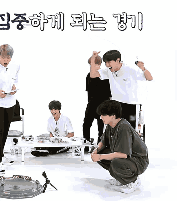 a group of young men are dancing in front of a sign that says ' oh ' on it