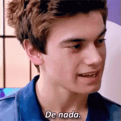 a close up of a young man 's face with the words de nada written on it .