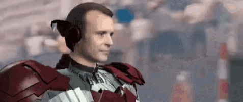a man in a superhero costume is wearing a pair of headphones