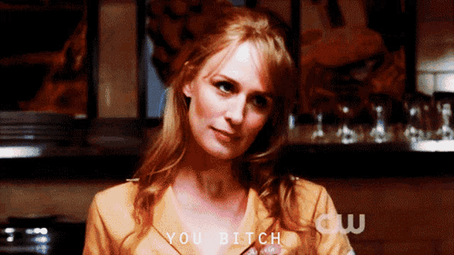 a woman says " you bitch " while wearing a yellow shirt