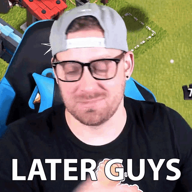 a man wearing glasses and a hat with the words later guys written below him