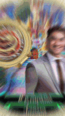 a blurry picture of a man playing roulette with a roulette wheel in the background