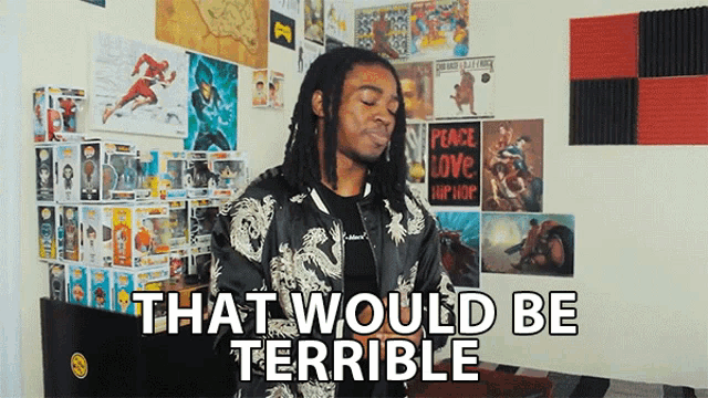 a man with dreadlocks says that would be terrible in front of a wall full of posters