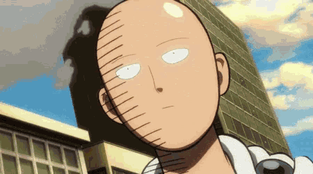 a close up of a bald man 's face with white eyes