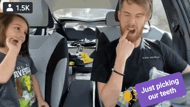 a man and a little girl in a car with a 1.5k icon on top