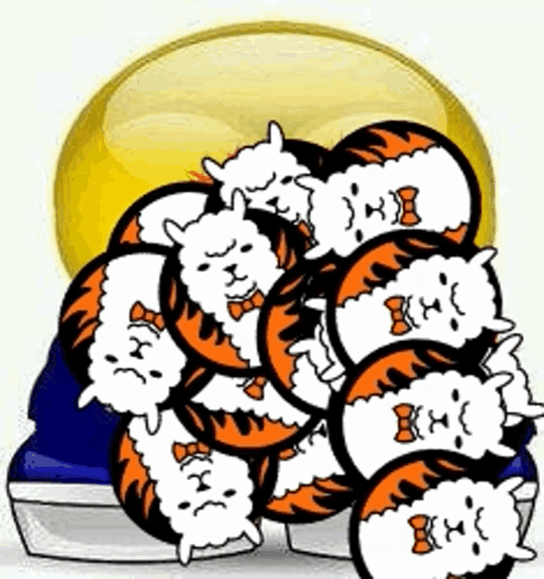 a bunch of cats are sitting next to each other on a table .