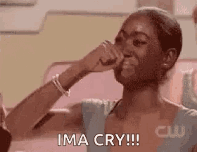 a woman is crying while holding her hand to her face and saying ima cry .