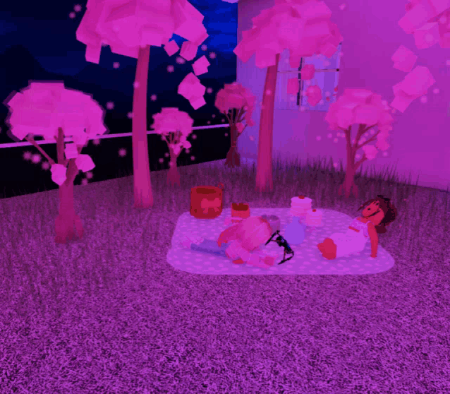 a girl is laying on a blanket with a cake and a candle