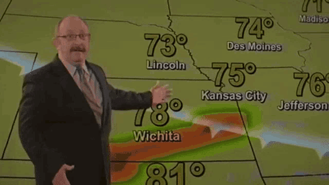 a man in a suit and tie stands in front of a map showing the temperatures in wichita and lincoln