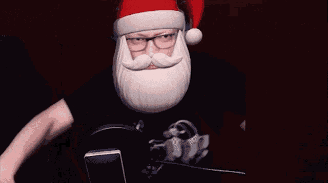 a man with a santa hat on his head and a beard