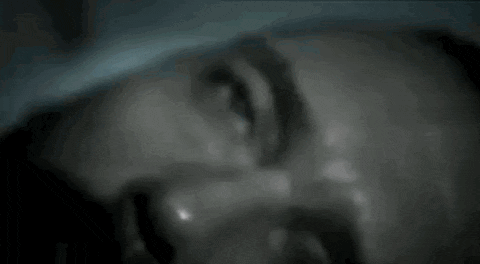 a close up of a man 's face with sweat coming out of it .