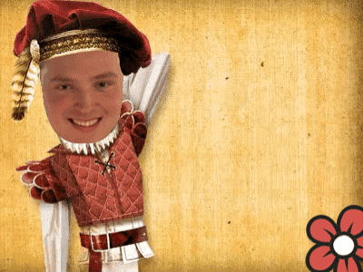 a puppet of a man with a red hat and feathers on his head