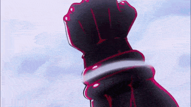 a close up of a person 's hand holding a sword in the air .