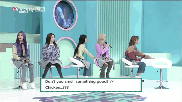 a group of women sitting in chairs with one saying " don t you smell something good chicken "